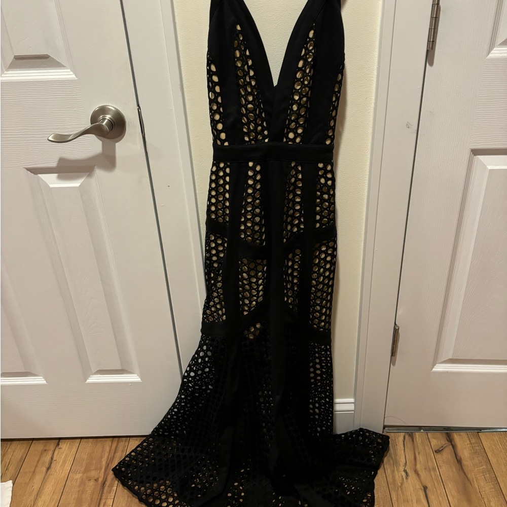 Absolutely stunning black dress. Mint condition size 4 cross cross back
